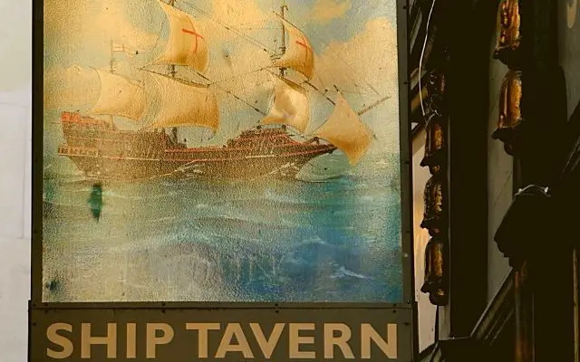 The Ship Tavern Holborn sign hanging by the entrance doorway